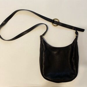 never used frye crossbody. Black leather with gold hardware.